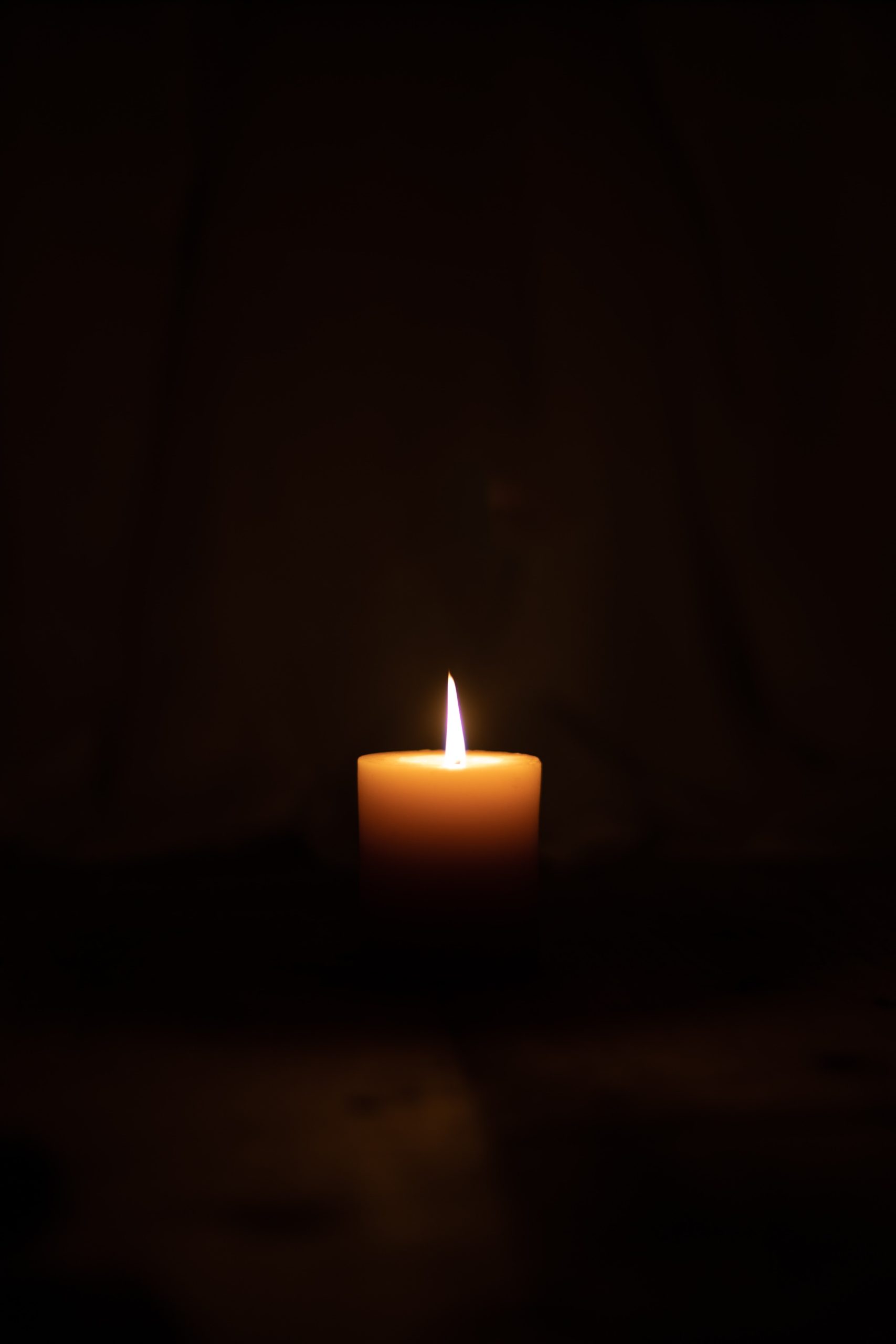 single candle glowing